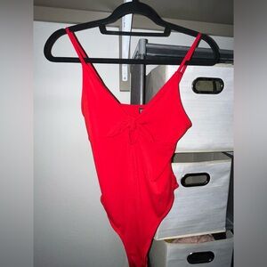 Women’s red bodysuit